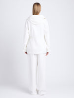 Back full length image of model wearing Nina Coat In Solid Cotton Crinkle in OFF WHITE