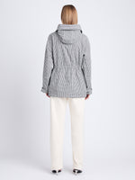Back full length image of model wearing Nina Coat In Grid Cotton Crinkle in BLACK/IVORY