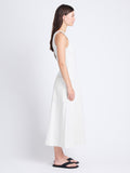 Side full length image of model wearing Arlet Sleeveless Dress In Stretch Twill in ECRU