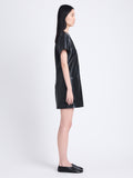 Side full length image of model wearing Sonny Dress In Faux Leather in BLACK