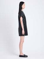 Side full length image of model wearing Sonny Dress In Faux Leather in BLACK