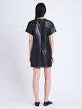 Back full length image of model wearing Sonny Dress In Faux Leather in BLACK