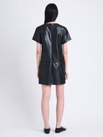 Back full length image of model wearing Sonny Dress In Faux Leather in BLACK