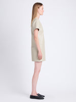 Side full length image of model wearing Sonny Dress In Faux Leather in CEMENT