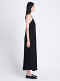 Side full length image of model wearing Celeste Dress In Lightweight Crepe in BLACK