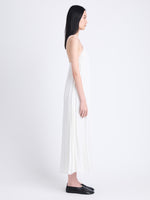 Side full length image of model wearing Celeste Dress In Lightweight Crepe in OFF WHITE