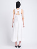 Back full length image of model wearing Juno Dress In Broderie Anglaise in OFF WHITE