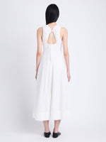 Back full length image of model wearing Juno Dress In Broderie Anglaise in OFF WHITE