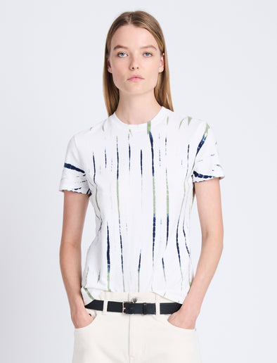 Cropped front image of model wearing Finley Tie Dye T-Shirt in white/navy/olive