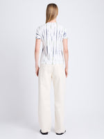 Back image of model wearing Finley Tie Dye T-Shirt in white/navy/olive