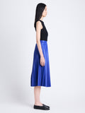 Side full length image of model wearing Daphne Skirt in Faux Leather in SAPPHIRE