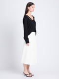Side full length image of model wearing Iris Wrap Skirt in Stretch Twill in ECRU