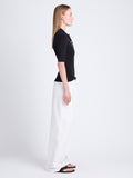 Side full length image of model wearing Amber Pant In Solid Cotton Crinkle in OFF WHITE