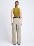 Back full length image of model wearing Amber Pant In Solid Cotton Crinkle in BAYLEAF