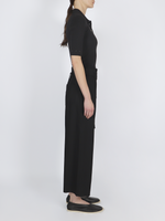Side image of model wearing Brooke Pant in Drapey Suiting in black