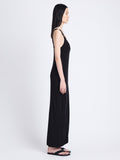 Side full length image of model wearing Hayden Dress In Midweight Button Details Knits in BLACK