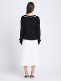 Back full length image of model wearing Elsie Top In Midweight Button Details Knits in BLACK