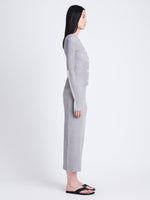 Side full length image of model wearing Winnie Sweater In Plaited Rib Knits in FOG/OFF WHITE