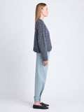 Side full length image of model wearing Remy Sweater In Chunky Marl in DARK BLUE/ OFF WHITE
