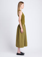 Side full length image of model wearing Malia Dress in Peached Poplin in OLIVE