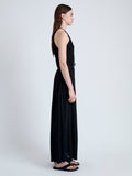 Side full length image of model wearing Lenny Dress in Matte Jersey in BLACK