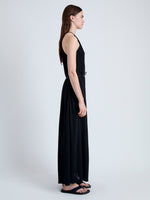 Side full length image of model wearing Lenny Dress in Matte Jersey in BLACK