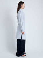 Side full length image of model wearing Lane Wrap Dress in Yarn Dye Shirting in WHITE/PEWTER