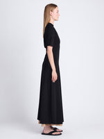Side image of model wearing Noelle Dress in Jersey in BLACK