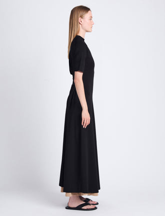 Side image of model wearing Noelle Dress in Jersey in BLACK