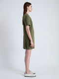 Side full length image of model wearing Watson Dress in Rumpled Cotton in DARK OLIVE