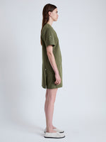 Side full length image of model wearing Watson Dress in Rumpled Cotton in DARK OLIVE