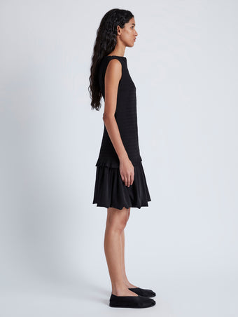 Side image of model wearing Martine Dress in Micro Pleat in BLACK