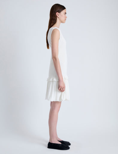Side full length image of model wearing Martine Dress in Micro Pleat in OFF WHITE