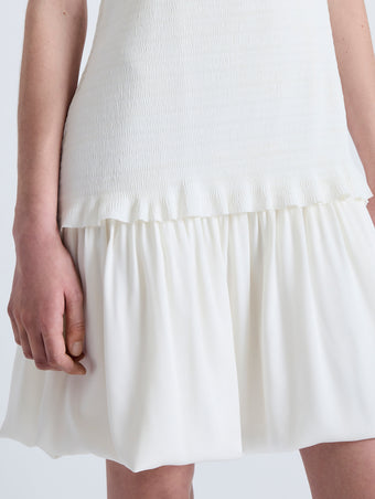 Detail image of model wearing Martine Dress in Micro Pleat in OFF WHITE