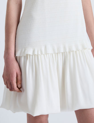 Detail image of model wearing Martine Dress in Micro Pleat in OFF WHITE