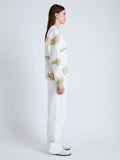 Side full length image of model wearing Blake Sweatshirt in Grid Tie Dye in WHITE/KHAKI