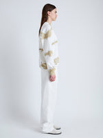 Side full length image of model wearing Blake Sweatshirt in Grid Tie Dye in WHITE/KHAKI