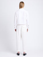 Back full length image of model wearing Alma Shirt in Peached Poplin in WHITE