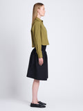 Side full length image of model wearing Alma Shirt in Peached Poplin in OLIVE
