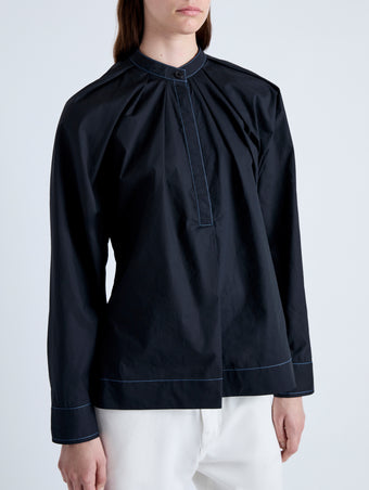 Detail image of model wearing Carter Top in Tech Poplin in BLACK