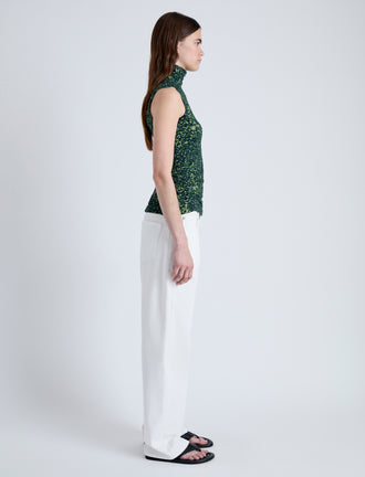 Side full length image of model wearing Ines Top in Shadow Print Jersey in DARK NAVY/OLIVE