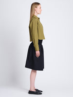 Side full length image of model wearing Olive Skirt in Peached Poplin in BLACK