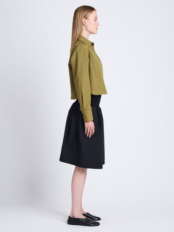 Side full length image of model wearing Olive Skirt in Peached Poplin in BLACK