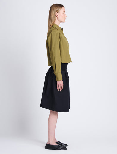 Side full length image of model wearing Olive Skirt in Peached Poplin in BLACK