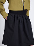 Detail image of model wearing Olive Skirt in Peached Poplin in BLACK