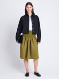 Front image of model wearing Olive Skirt in Peached Poplin in OLIVE