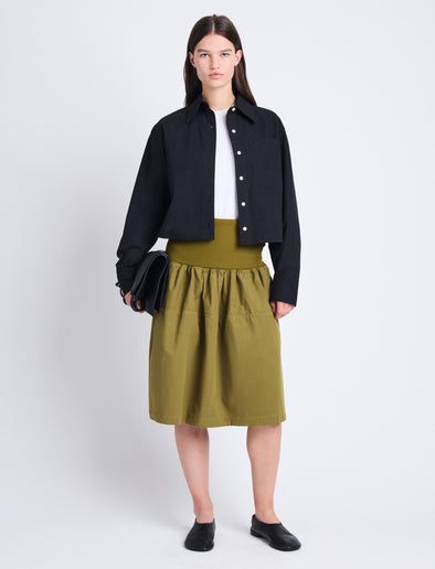 Front image of model wearing Olive Skirt in Peached Poplin in OLIVE