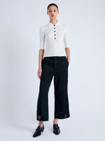 Front full length image of model wearing Cooper Knit Polo in Micro Cable in OFF WHITE