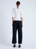 Back full length image of model wearing Cooper Knit Polo in Micro Cable in OFF WHITE