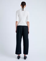 Back full length image of model wearing Cooper Knit Polo in Micro Cable in OFF WHITE